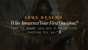 Who Answered Your First Question? » Iron Realms Entertainment Hero banner for Iron Realms article: 'Who Answered Your First Question?' over a guitarist in a dark, ornate background.